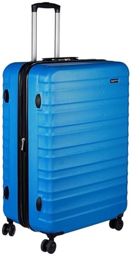 Amazon Basics Hartschalen-Koffer Groß - Erweiterbares ABS-Reisegepäck mit 4 Doppel-Spinnerrädern - Kratzfest und Leicht - 78 x 52,6 x 32cm - Hellblau