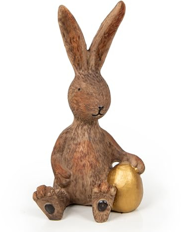 Dekofigur Osterhase Sitzend: Hasen-Deko Ostern & Frühling, Osterdeko Figur, Dekohase mit Osterei, Osterdekoration Tisch & Fensterbank, Osterhasen Frühlingsdeko, Dekohase Braun & Gold, 17 x 9 x 8 cm